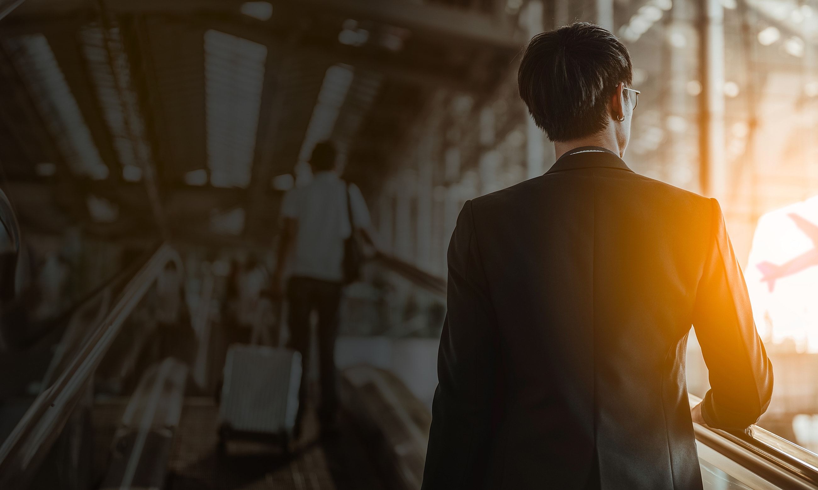 Business traveler at the airport sunset.