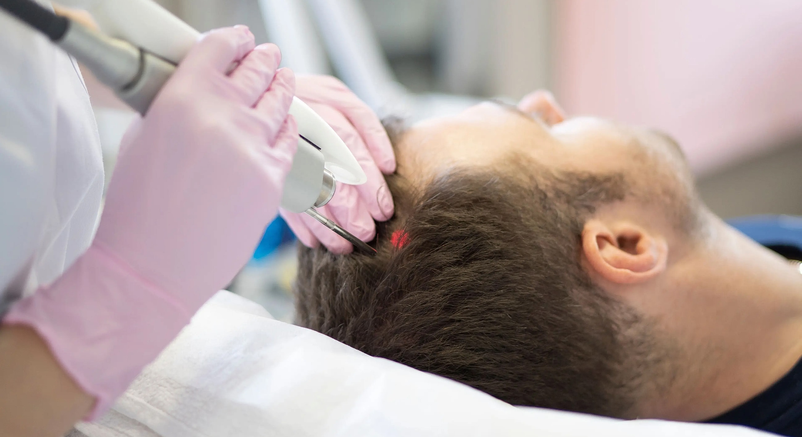 Hair treatment procedure in a clinical setting.