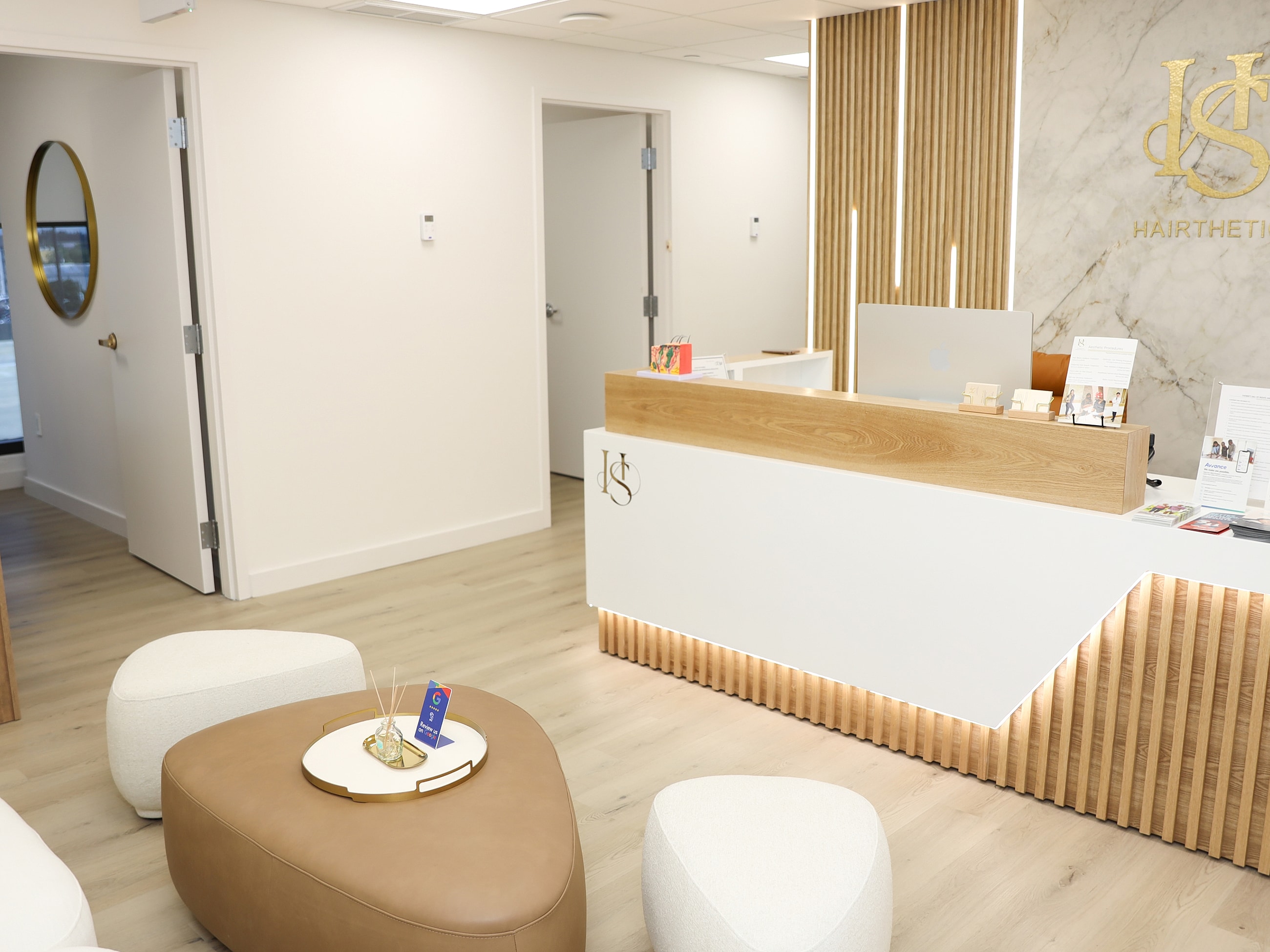 Modern hair salon reception area with seating.
